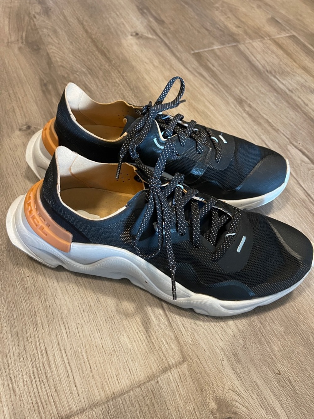 Sorel Mesh Black and White Sneakers with Orange Heel.  Super comfortable!